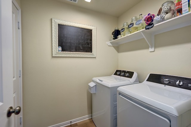 1009 Old Vine, Brenham, TX 77833 - washroom with separate washer and dryer and wood finished floors