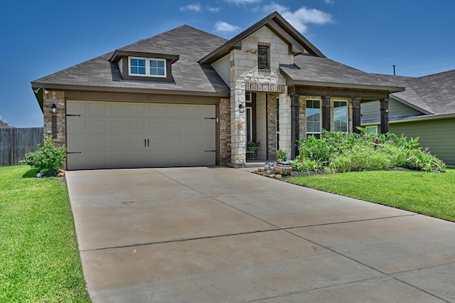 1009 Old Vine, Brenham, TX 77833 - french provincial home with stone siding, concrete driveway, a garage, and roof with shingles