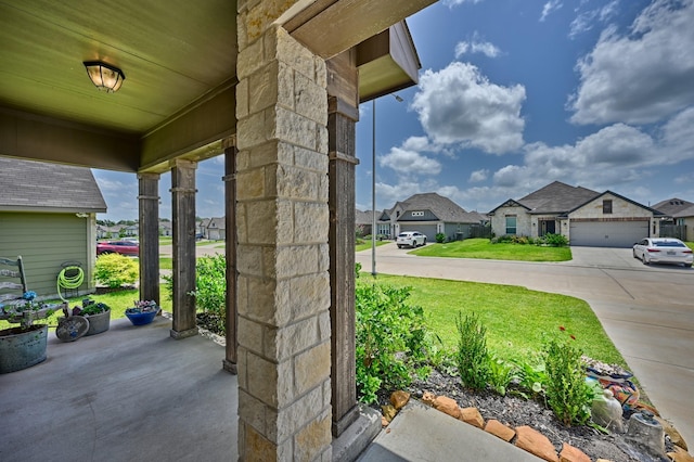 1009 Old Vine, Brenham, TX 77833 - view of patio with a residential view and concrete driveway