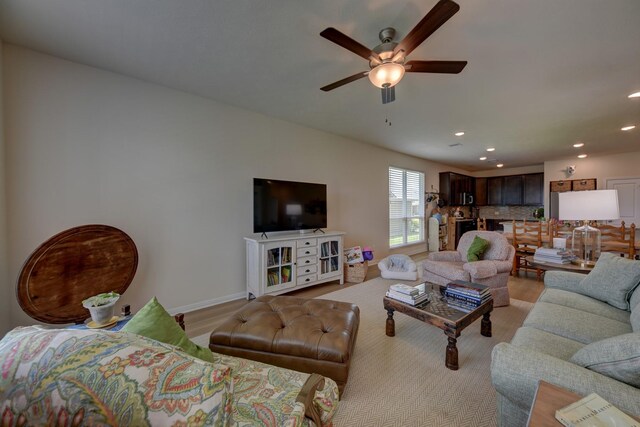 1009 Old Vine, Brenham, TX 77833 - living room featuring a ceiling fan, recessed lighting, and light wood-style floors