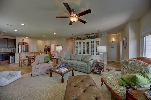 1009 Old Vine, Brenham, TX 77833 - living area featuring light wood-style flooring, a ceiling fan, and recessed lighting