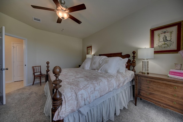 1009 Old Vine, Brenham, TX 77833 - bedroom featuring light colored carpet, ceiling fan, and light tile patterned floors