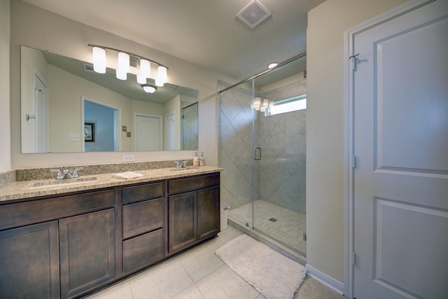 1009 Old Vine, Brenham, TX 77833 - full bath featuring tile patterned flooring, double vanity, and a shower stall