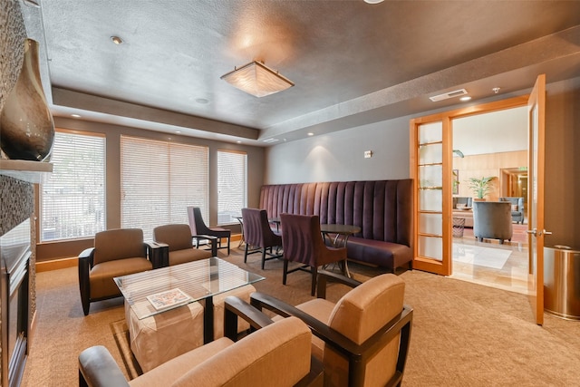 3505 Sage Rd Unit 1206, Houston, TX 77056 - living area featuring carpet floors, a tray ceiling, and recessed lighting