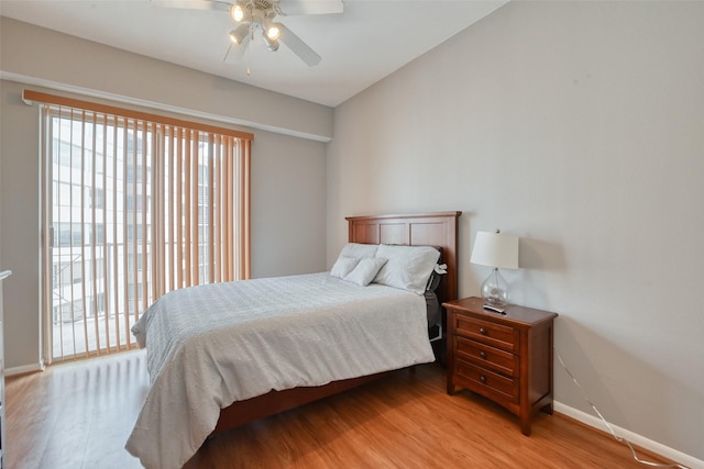 3505 Sage Rd Unit 1206, Houston, TX 77056 - bedroom featuring light wood finished floors, access to exterior, and ceiling fan