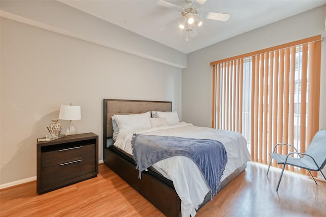 3505 Sage Rd Unit 1206, Houston, TX 77056 - bedroom featuring light wood-style floors and a ceiling fan