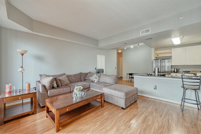 3505 Sage Rd Unit 1206, Houston, TX 77056 - living room featuring light wood-style flooring
