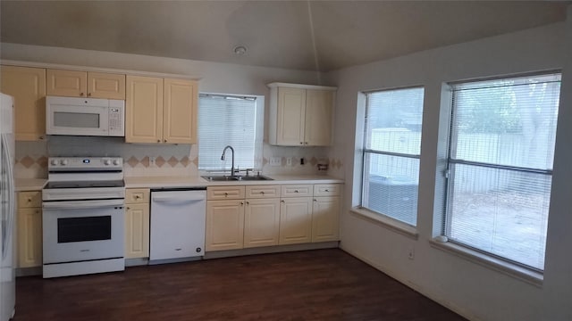 11718 Emerald Wood Dr, Houston, TX 77070 - kitchen featuring white appliances, lofted ceiling, light countertops, dark wood-style floors, and tasteful backsplash