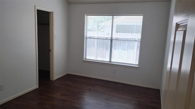 11718 Emerald Wood Dr, Houston, TX 77070 - unfurnished bedroom featuring dark wood-style flooring and a spacious closet