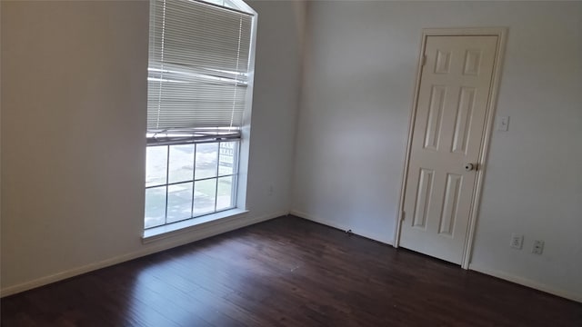 11718 Emerald Wood Dr, Houston, TX 77070 - spare room featuring dark wood-style floors and baseboards