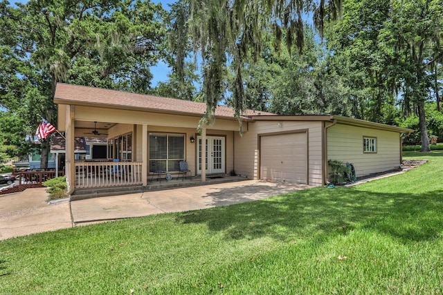 63 Harbour Row Dr, Coldspring, TX 77331 - ranch-style house featuring an attached garage, a front lawn, french doors, driveway, and ceiling fan