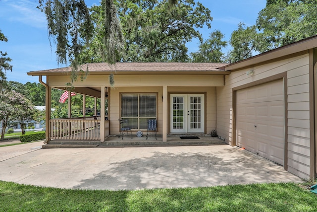 63 Harbour Row Dr, Coldspring, TX 77331 - doorway to property with french doors and an attached garage