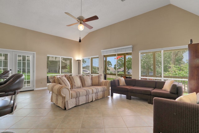 63 Harbour Row Dr, Coldspring, TX 77331 - living area with high vaulted ceiling, a ceiling fan, light tile patterned flooring, and french doors