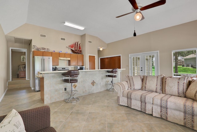 63 Harbour Row Dr, Coldspring, TX 77331 - living area featuring a ceiling fan, attic access, high vaulted ceiling, light tile patterned floors, and french doors