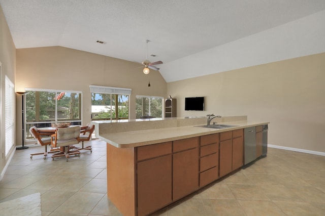 63 Harbour Row Dr, Coldspring, TX 77331 - kitchen with dishwasher, open floor plan, light countertops, a ceiling fan, and light tile patterned flooring