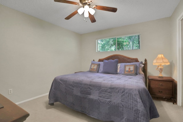 63 Harbour Row Dr, Coldspring, TX 77331 - bedroom featuring carpet flooring, a ceiling fan, and a textured ceiling