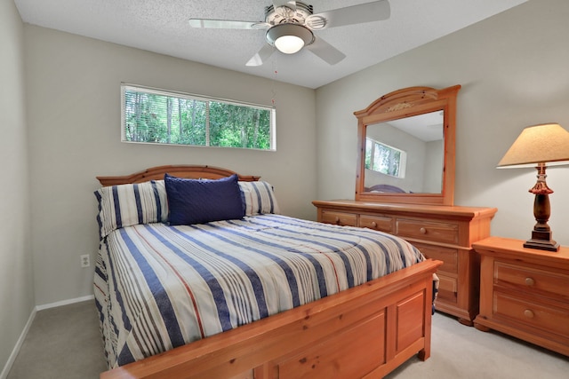63 Harbour Row Dr, Coldspring, TX 77331 - bedroom with light colored carpet, a ceiling fan, and a textured ceiling