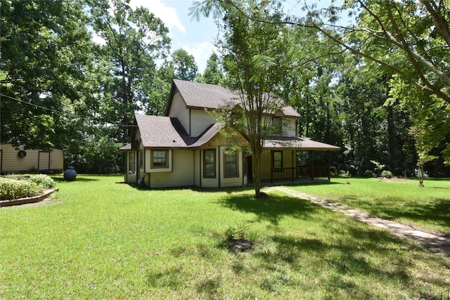191 Harvey Bryant Rd, Coldspring, TX 77331 - view of front facade with a front yard, roof with shingles, and a porch