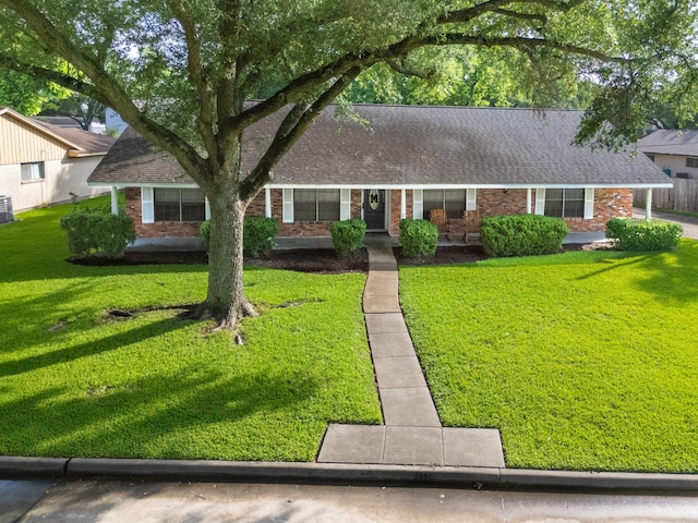 3405 Randall St, Pearland, TX 77581 - view of front of property with a front lawn, brick siding, and roof with shingles