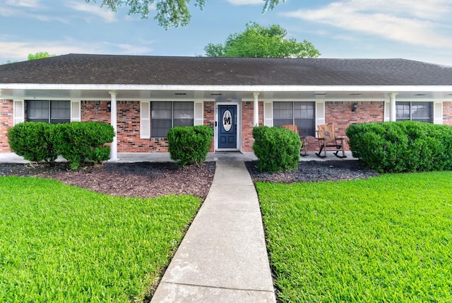 3405 Randall St, Pearland, TX 77581 - ranch-style home featuring a front yard, brick siding, and a shingled roof