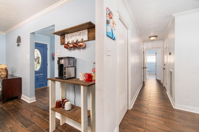 3405 Randall St, Pearland, TX 77581 - hall featuring dark wood-style floors, ornamental molding, and a textured ceiling