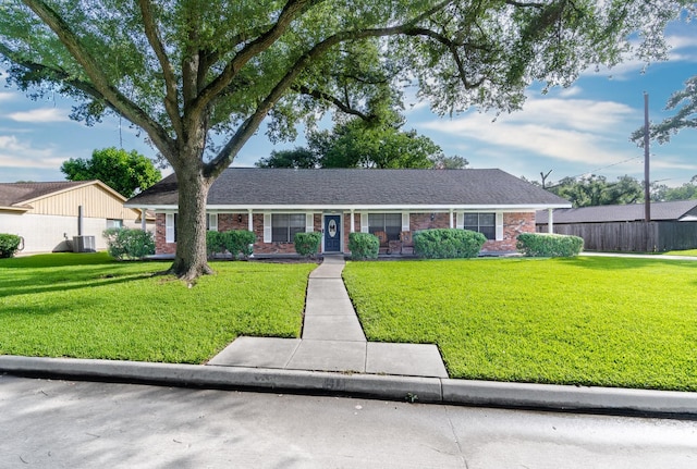 3405 Randall St, Pearland, TX 77581 - ranch-style home featuring a front yard and brick siding