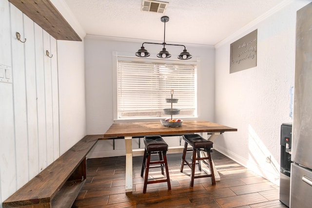 3405 Randall St, Pearland, TX 77581 - dining space with ornamental molding, hardwood / wood-style flooring, a chandelier, a textured ceiling, and breakfast area