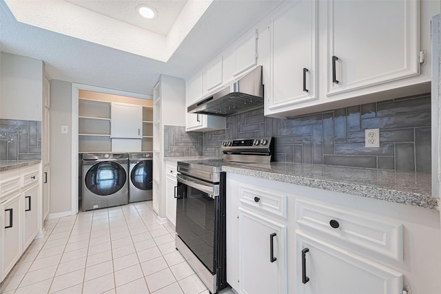 6822 Stonewater, Houston, TX 77084 - kitchen with stainless steel range with electric stovetop, washer and clothes dryer, under cabinet range hood, decorative backsplash, and white cabinetry