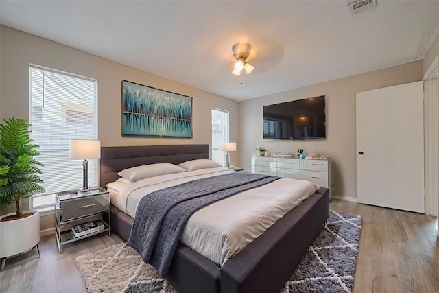 6822 Stonewater, Houston, TX 77084 - bedroom with light wood finished floors and a ceiling fan