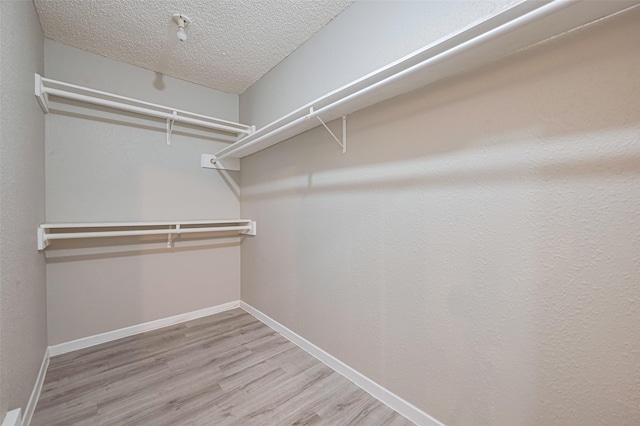 6822 Stonewater, Houston, TX 77084 - spacious closet featuring wood finished floors