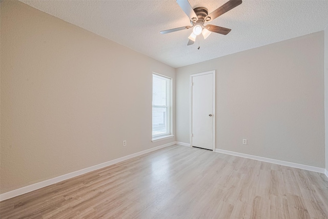 6822 Stonewater, Houston, TX 77084 - spare room with a ceiling fan, light wood-type flooring, and a textured ceiling