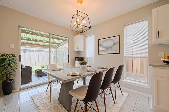 6822 Stonewater, Houston, TX 77084 - dining area featuring light tile patterned floors and a chandelier