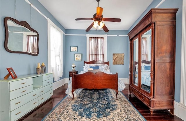 2113 Ball, Galveston, TX 77550 - bedroom with dark wood-type flooring and ceiling fan