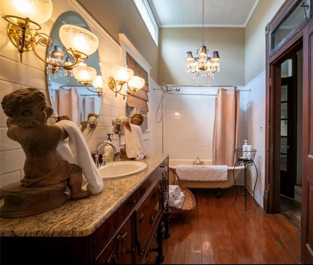 2113 Ball, Galveston, TX 77550 - full bath featuring a chandelier, wood-type flooring, crown molding, vanity, and shower / bath combination with curtain