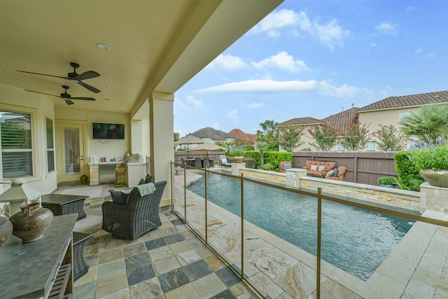 9503 Martha Springs Dr, Houston, TX 77070 - balcony with exterior kitchen, an outdoor hangout area, and ceiling fan