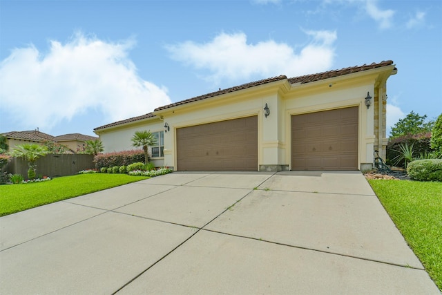 9503 Martha Springs Dr, Houston, TX 77070 - view of front of property featuring a garage, concrete driveway, a tiled roof, and stucco siding