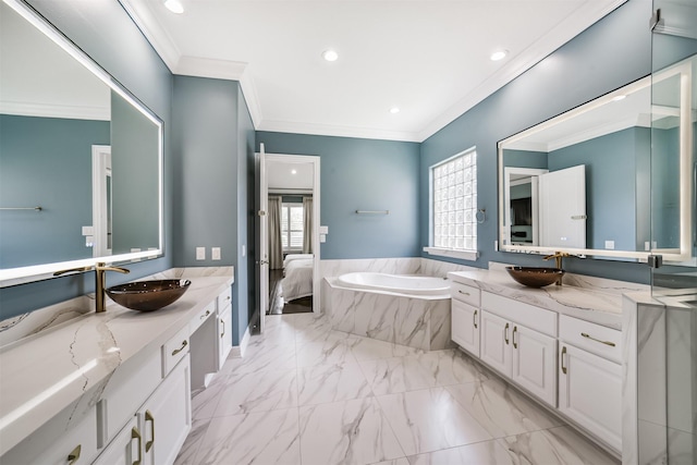 9503 Martha Springs Dr, Houston, TX 77070 - bathroom with ornamental molding, a bath, two vanities, recessed lighting, and marble finish floors