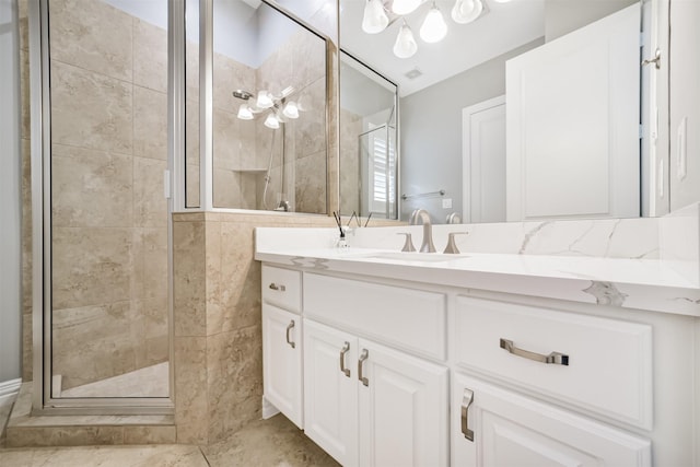 9503 Martha Springs Dr, Houston, TX 77070 - bathroom featuring a stall shower, vanity, and a chandelier