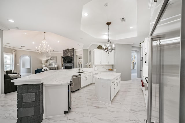 9503 Martha Springs Dr, Houston, TX 77070 - kitchen featuring a chandelier, stainless steel dishwasher, arched walkways, high end fridge, and recessed lighting