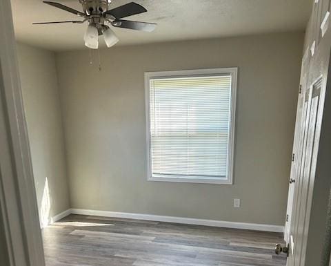 2308 13th Ave N, Texas City, TX 77590 - spare room featuring wood finished floors, plenty of natural light, and a ceiling fan
