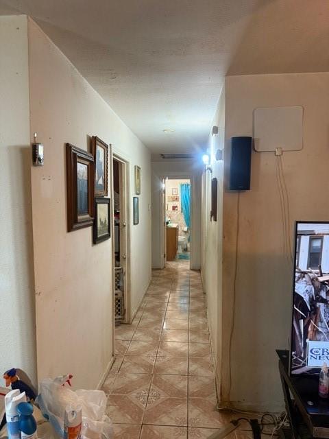 4514 Kress St, Houston, TX 77026 - corridor featuring light tile patterned floors