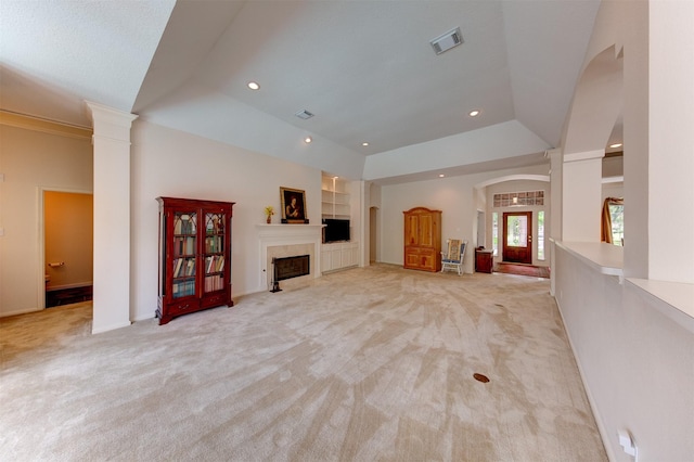 3910 Sand Myrtle Dr, Houston, TX 77059 - unfurnished living room with lofted ceiling, decorative columns, built in features, light colored carpet, and a premium fireplace