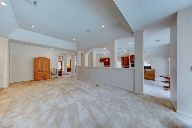 3910 Sand Myrtle Dr, Houston, TX 77059 - unfurnished living room with decorative columns, light colored carpet, arched walkways, and recessed lighting