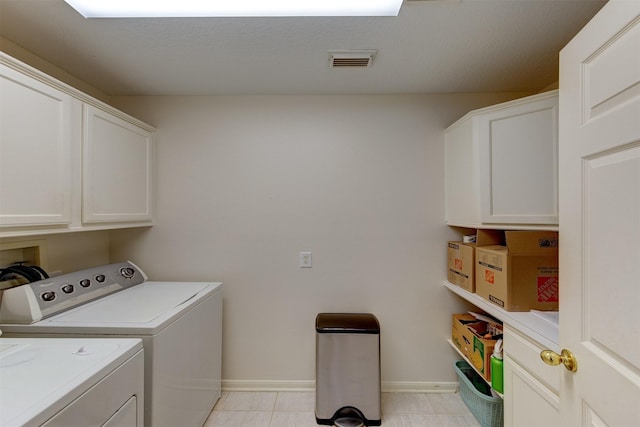 3910 Sand Myrtle Dr, Houston, TX 77059 - laundry room with cabinet space, washer and dryer, and light tile patterned flooring