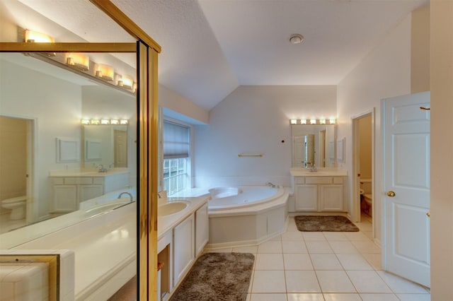 3910 Sand Myrtle Dr, Houston, TX 77059 - full bathroom featuring a garden tub, two vanities, tile patterned floors, and lofted ceiling