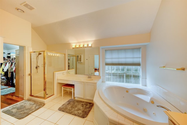 3910 Sand Myrtle Dr, Houston, TX 77059 - bathroom featuring a shower stall, a jetted tub, lofted ceiling, tile patterned floors, and vanity