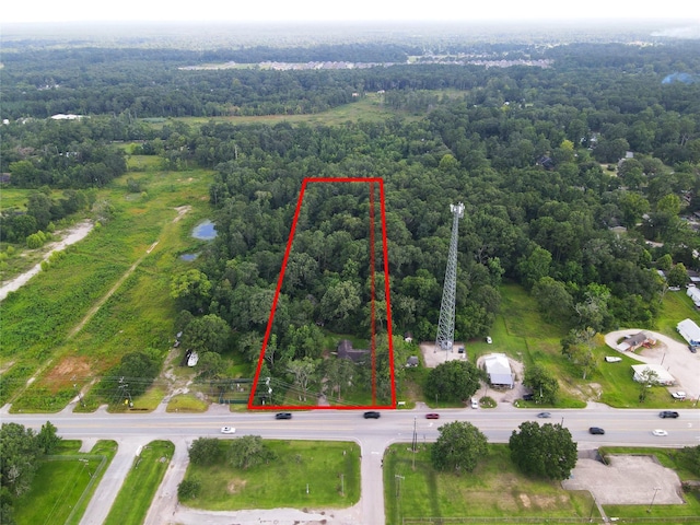 26334 Fm 2090th Rd, Splendora, TX 77372 - aerial overview of property's location featuring property boundaries highlighted and a forest