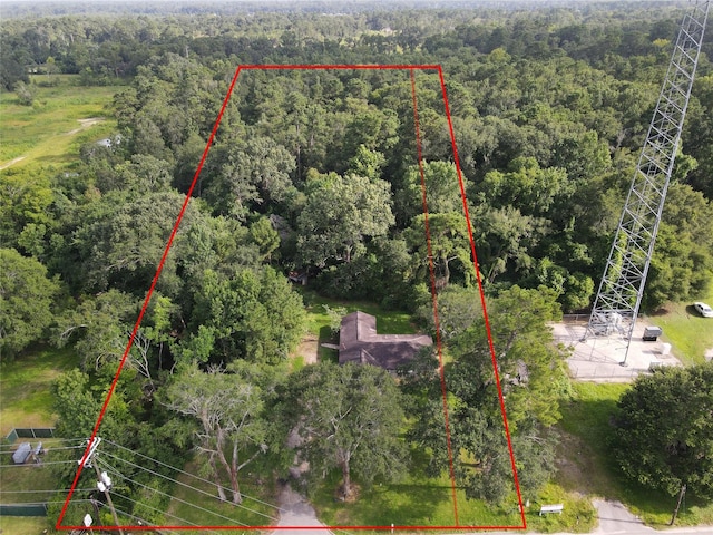 26334 Fm 2090th Rd, Splendora, TX 77372 - aerial view of property's location featuring a heavily wooded area and property parcel outlined