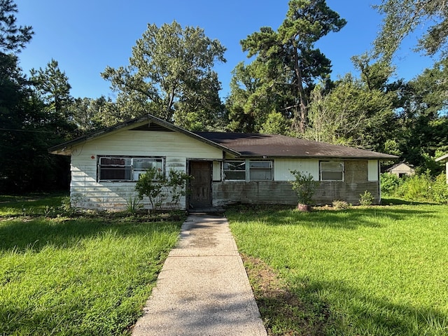 26334 Fm 2090th Rd, Splendora, TX 77372 - view of front of home with a front lawn