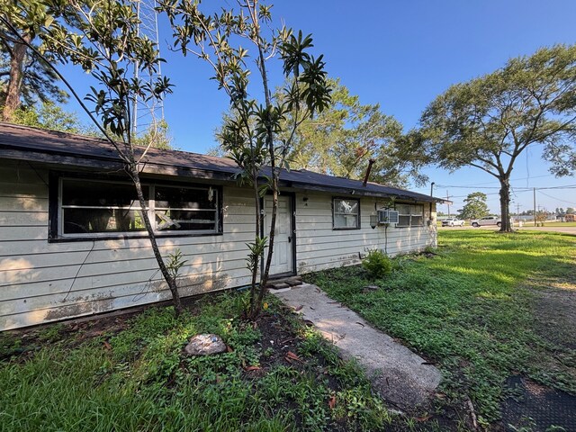 26334 Fm 2090th Rd, Splendora, TX 77372 - view of home's exterior with a yard